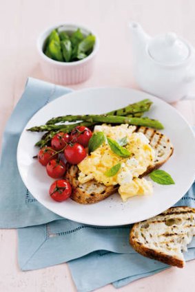 Egged on … scrambled eggs with asparagus and tomatoes.