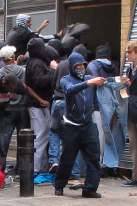 Street style ... rioting youths raid a clothing store.