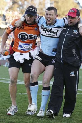 "If it's a tear, he'll need surgery. It's a 12-to-16 week recovery for most people, so he'll be back by the start of next season" ... Cronulla doctor David Givney on Todd Carney's Achilles injury.