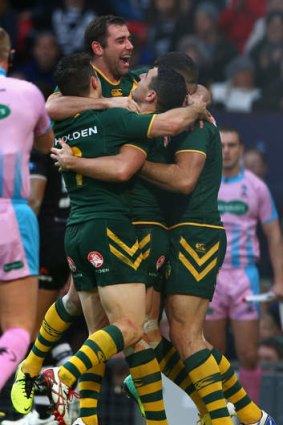 Oh yeah: Billy Slater celebrates a try with World Cup-winning teammates Cameron Smith, Cooper Cronk and Greg Inglis.