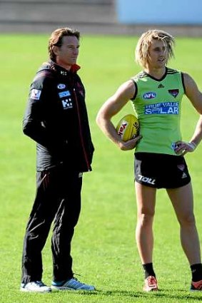 Essendon coach James Hird with Dyson Heppell at a recent training session.