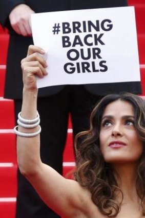 The campaign to find the more than 200 girls kidnapped by Boko Haram has achieved global momentum. Actress and producer Salma Hayek holds a placard as she poses on the red carpet at the Cannes Film Festival in France.