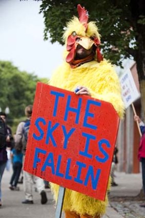 Zeb Krieger dresses as a chicken with a dramatic message in Portland.