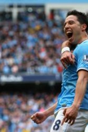 Manchester City's Samir Nasri and Pablo Zabaleta.