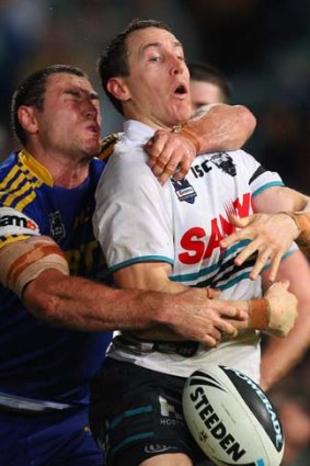 Wrapped up . . .  David Simmons of the Panthers is tackled by Ben Smith of the Eels.