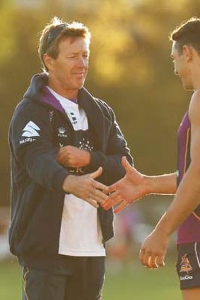 Good call: Billy Slater congratulates Craig Bellamy on his decision to stay at Storm.