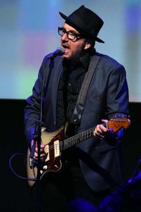 Elvis Costello performs at the Apple event.