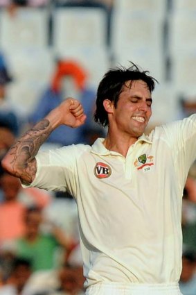 Mitchell Johnson celebrates a wicket in India.