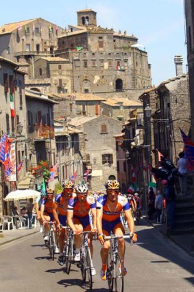Rolling through town ... the peloton in action on the sixth stage from Orvieto to Fiuggi on Thursday.