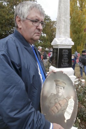 Mark Ellery, the writer's brother, who was named after the Ellery brothers's father, Mark Pascoe Ellery, with a picture of Gunner Stephen Ellery at the re-dedication of the Neville war memorial on April 19, 2015. Stephen and Joe are listed on the plaque immediately behind him. John Ellery is listed separately. Samson Ellery is not listed on the memorial. 
