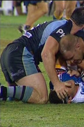 Paul Gallen grabs at the head bandages of Anthony Laffranchi in an incident that led to some commentators to call for him to be criminally charged.