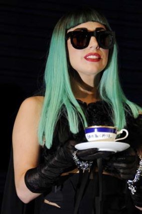Lady Gaga drinking from a teacup with 'Pray for Japan' engraved in it in June last year.