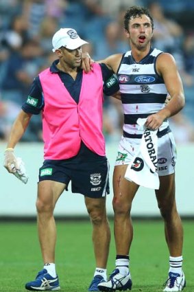 George Burbury leaves the field after sustaining a facial injury during the NAB Challenge match against Collingwood on Wednesday night.