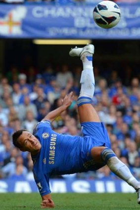 Chelsea's John Terry jumps for the ball.