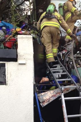 "Name any item and it's here": firefighters were forced to use ladders to climb over the fence.