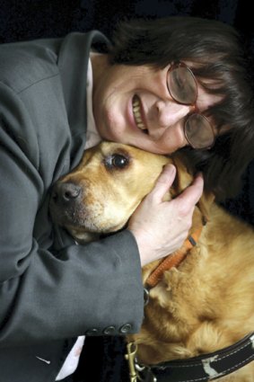Michelle Stevens with her guide dog Oscar.