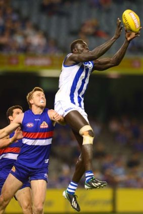 On the rise: Majak Daw marks against the Western Bulldogs.