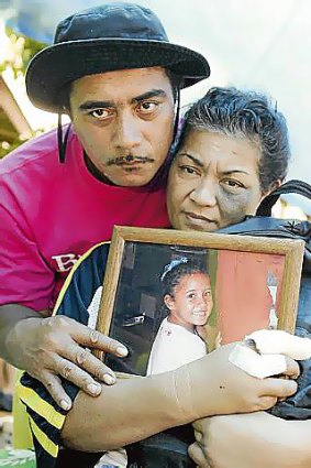 Faataui Fitiao and his wife Taitasi Su apaia Fitiao with a picture of their daughter.