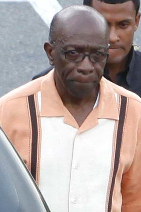 Jack Warner (front) leaves a cabinet meeting after resigning his government post.