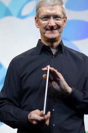 Apple CEO Tim Cook shows off the iPad Air.