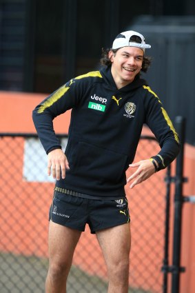 Daniel Rioli tries to walk on his injured leg to show an assistant coach. 