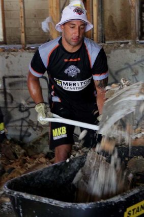 The Wests Tigers captain hard at work helping flood-affected Goodna, west of Brisbane.