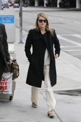 Effortless: Everyone should own a black trench like Ali Larter's.
