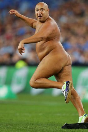 Spring in his step: a streaker runs onto the field.
