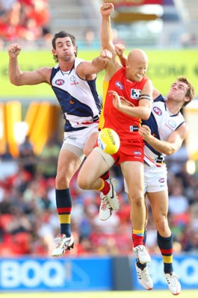 Taylor Walker of the Crows and Gary Ablett contest in round one.
