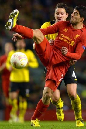 Liverpool's Luis Suarez vies with BSC Young Boys' Alain Nef during the UEFA Europa League group A game.