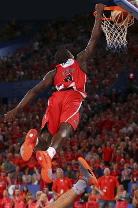 Perth import James Ennis dunks the ball with relentless authority, as he's done many times for the Wildcats this season.