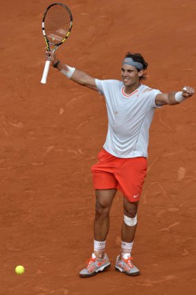 Sweet success: Rafael Nadal celebrates his quarter-final win, setting up a clash with Novak Djokovic.