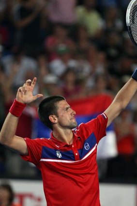 Novak Djokovic celebrates beating Lleyton Hewitt on day four of the Hopman Cup.