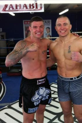Australia's multiple Muay Thai world champion, "John" Wayne Parr (left) with the UFC welterweight champion Georges St-Pierre following a training session in Canada last month.