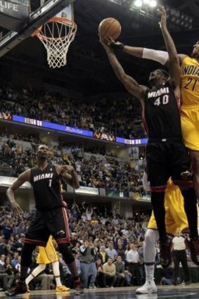 Indiana Pacers forward David West fights for a rebound with Miami Heat forward Udonis Haslem in Indianapolis. The Pacers won 84-83. 