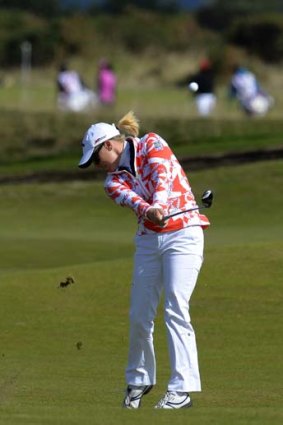 Tournament leader Morgan Pressel of the US plays her approach shot to the 15th green during the third round of the Women's British Open golf championship at St Andrews in Scotland on Sunday.