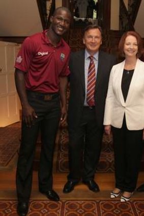 Prime Minister Julia Gillard and her partner Tim Mathieson with West Indies captain Darren Sammy and PM's XI vice-captain Brad Haddin.