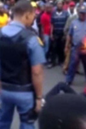 South Africa's police watchdog is investigating the death in custody of a Mozambican taxi driver who was filmed being dragged behind a police vehicle.