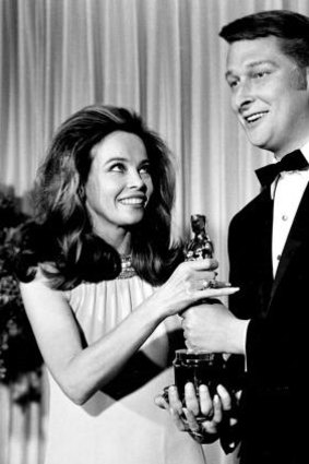 French actress-dancer Leslie Caron presents the Oscar for best director for the movie <i>The Graduate</i> to director Mike Nichols at the 1967 Academy Awards.