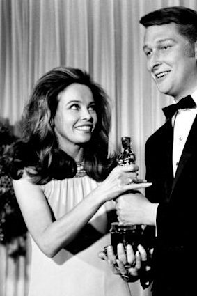 French actress-dancer Leslie Caron presents the Oscar for best director for the movie <i>The Graduate</i> to director Mike Nichols at the 1967 Academy Awards.