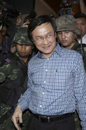 Detained: ousted Thai education minister Chaturon Chaisang is taken from the Foreign Correspondents' Club of Thailand by soldiers on Tuesday.