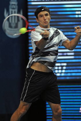 Australian Marinko Matosevic plays a shot against Ivo Karlovic at the Thailand Open.