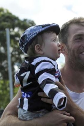 Travis Cloke with seven-month-old Rubin Cassar at Victoria Park.