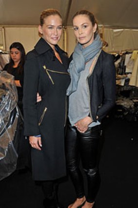 Bar Refaeli and Elle Macpherson pose backstage before the Louis Vuitton show at Paris Fashion Week.