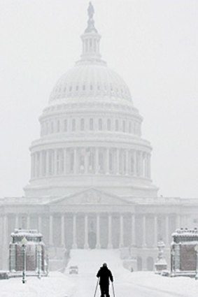 A skier approaches the US Capitol building in Washington on Saturday.