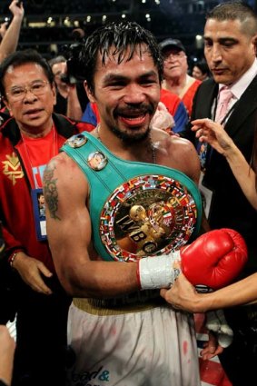 Battered but victorious . . . Manny Pacquiao.