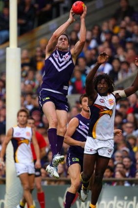 Luke McPharlin takes a strong mark ahead of Nic Naitanui of the Eagles during a round 18 match.