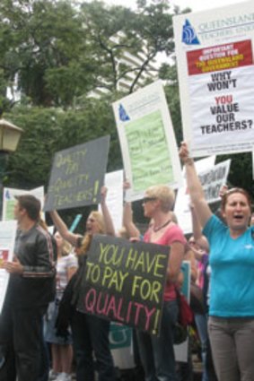 Disgruntled Queensland teachers rally at Parliament House in Brisbane today.