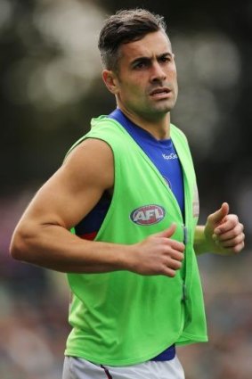Daniel Giansiracusa warms up during the match against Port Adelaide.