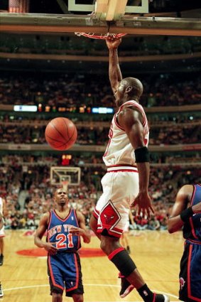 Michael Jordan dunks the ball during the game for Chicago against the New York Knicks at the United Center in Chicago in 1996. The Bulls defeated the Knicks 91-84.